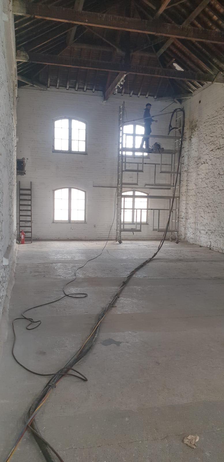 Sandblasting to expose historical walls and beams at Topsham Brewery and Taproom in Devon