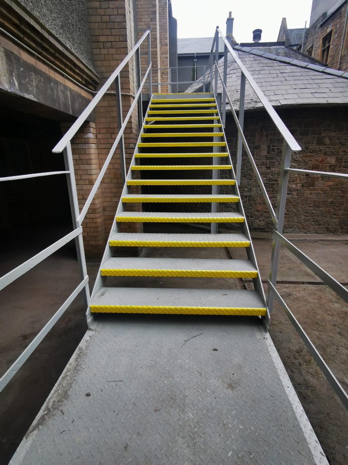 Shot blasting, prime and top coats, for external staircases at Wonford Hospital, Exeter