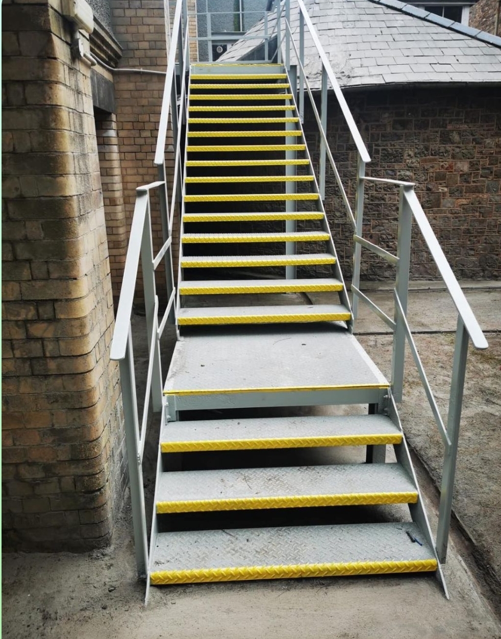 Shot blasting, prime and top coats, for external staircases at Wonford Hospital, Exeter